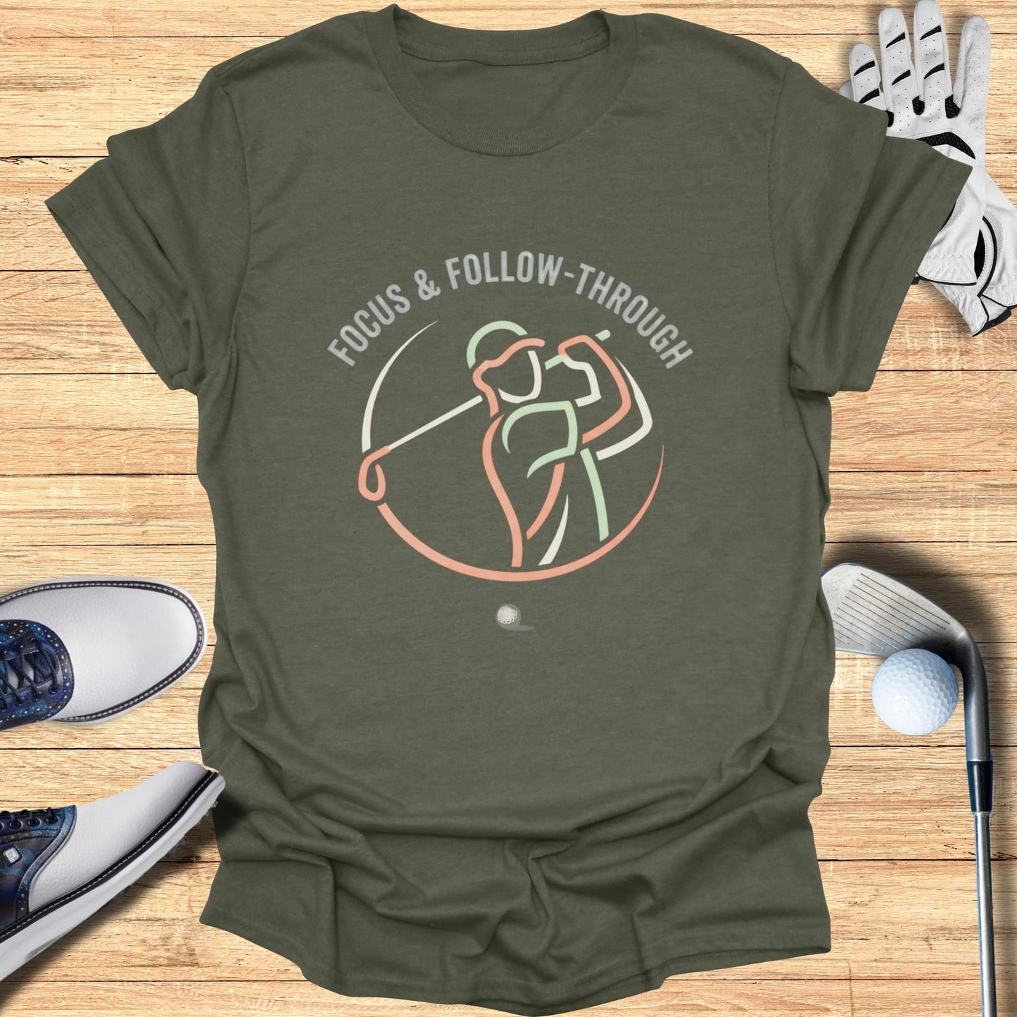 T-shirt with a circular graphic of a golfer swinging and the text "FOCUS & FOLLOW-THROUGH".