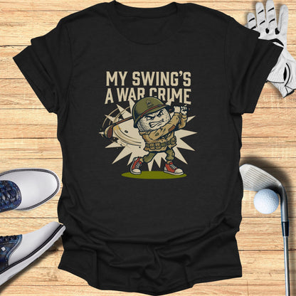 T-shirt graphic of a cartoon soldier swinging a golf club with text "MY SWING'S A WAR CRIME".