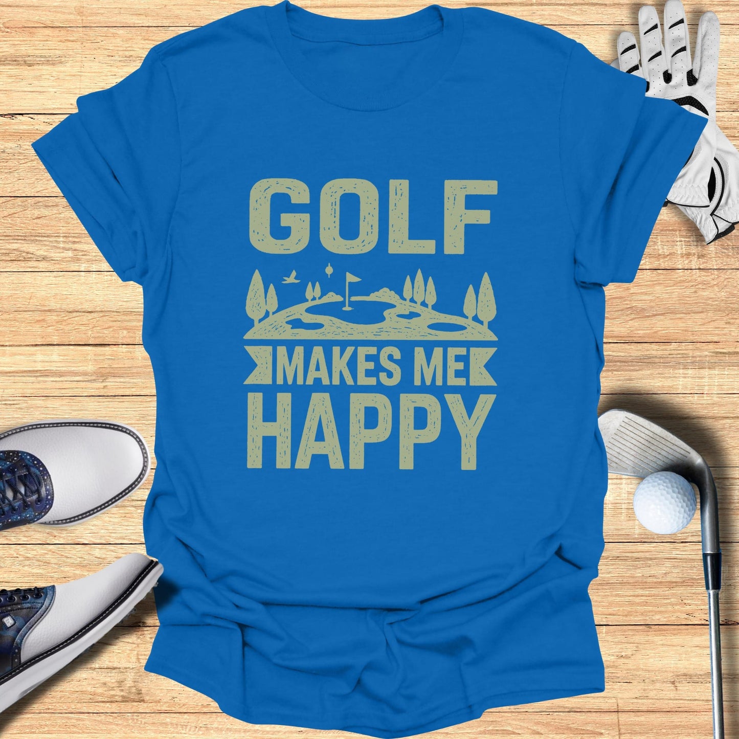 Blue t-shirt with "GOLF MAKES ME HAPPY" text and golf accessories.