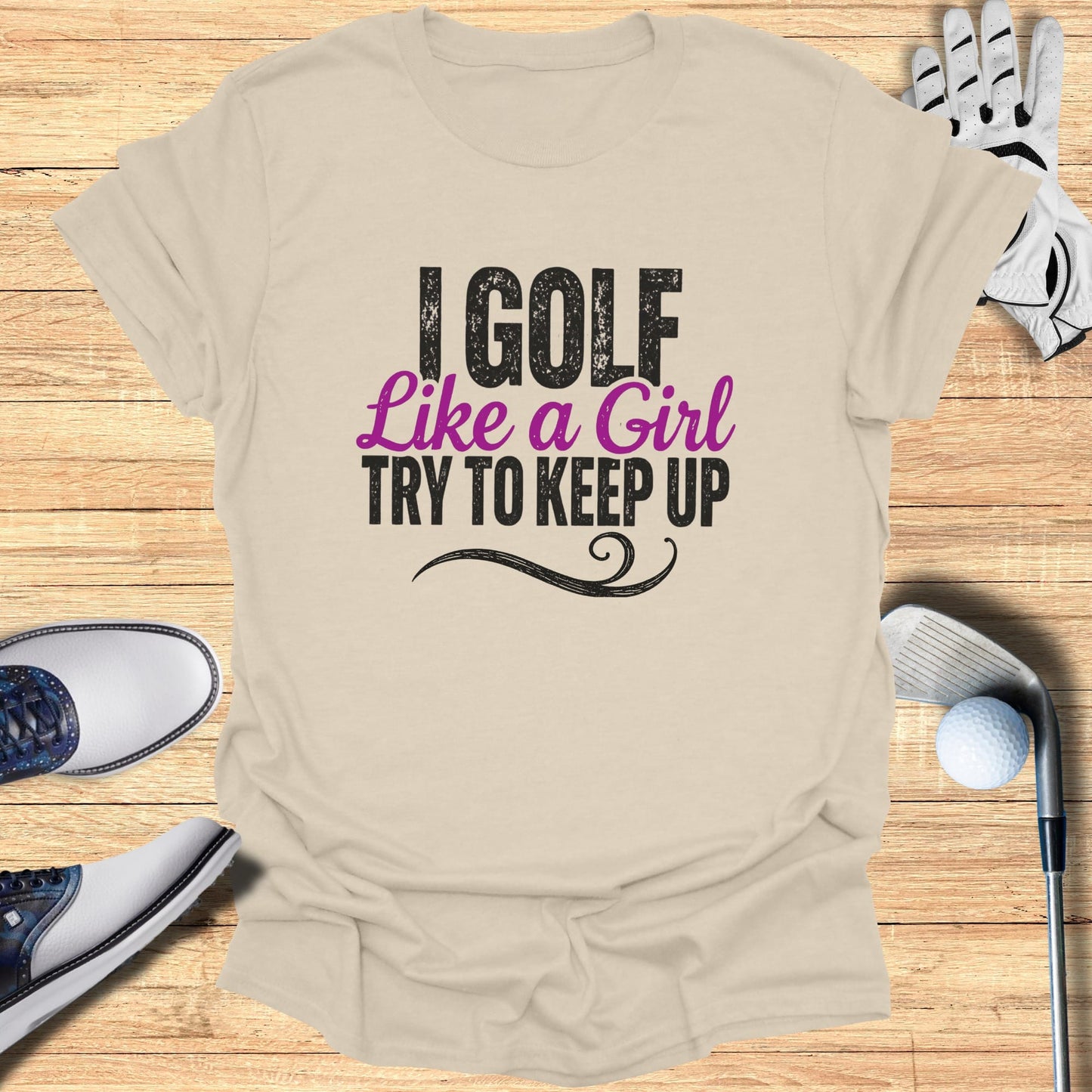 T-shirt with text "I golf like a girl try to keep up".