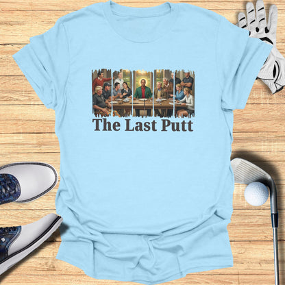 Light blue t-shirt with "The Last Putt" text and a drawing of men playing golf.