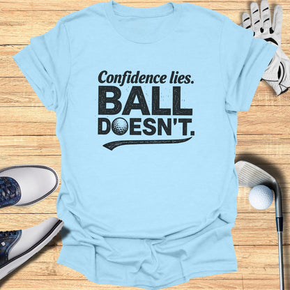 Light blue t-shirt with "Confidence lies. BALL DOESN'T." text and golf accessories.