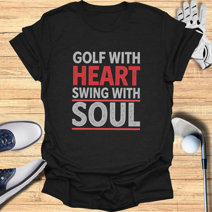 Black t-shirt with "Golf with Heart, Swing with Soul" text.