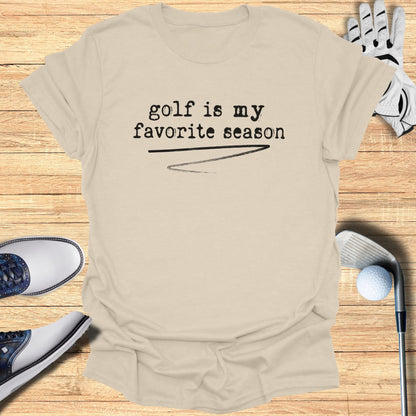 Cream t-shirt with "golf is my favorite season" text, golf club, glove, and shoes.