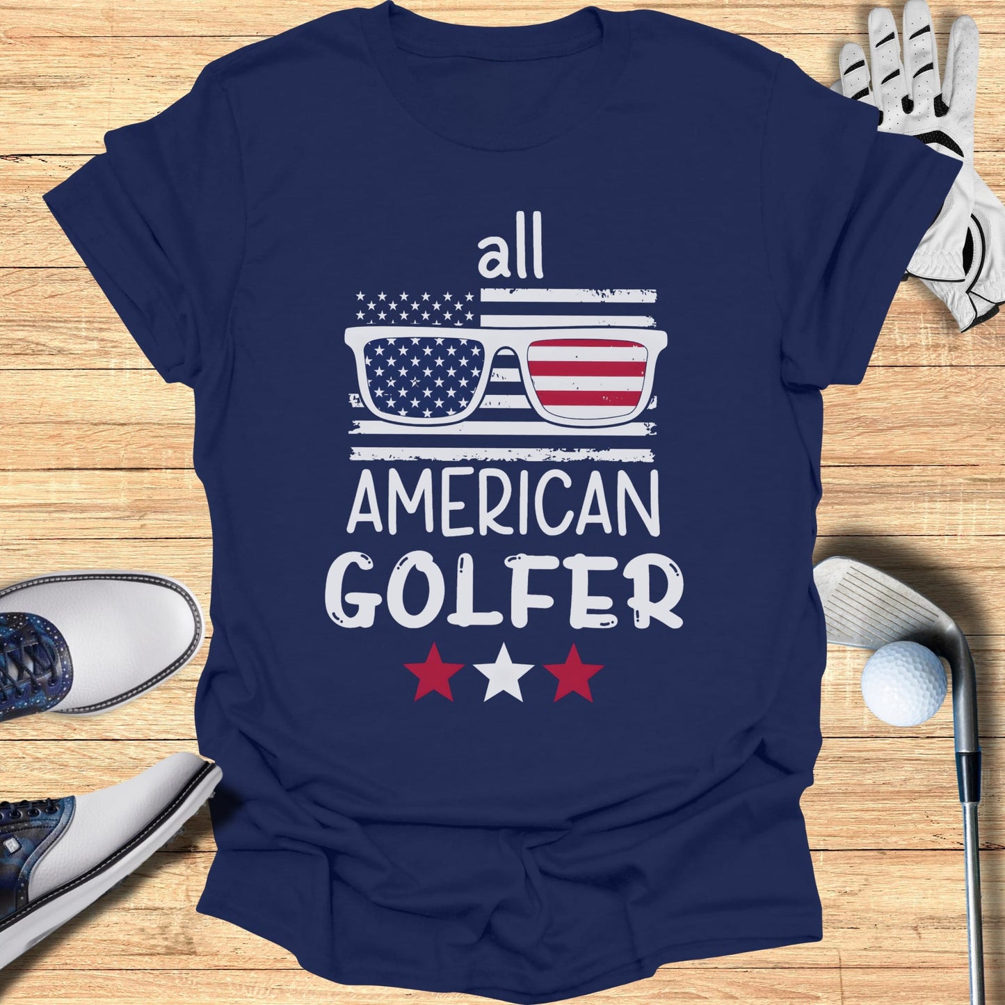 Navy t-shirt with "all AMERICAN GOLFER" and American flag sunglasses design.