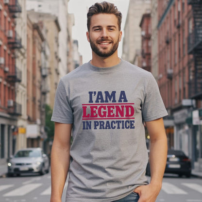 Man wearing a gray t-shirt with "I AM A LEGEND IN PRACTICE" text.