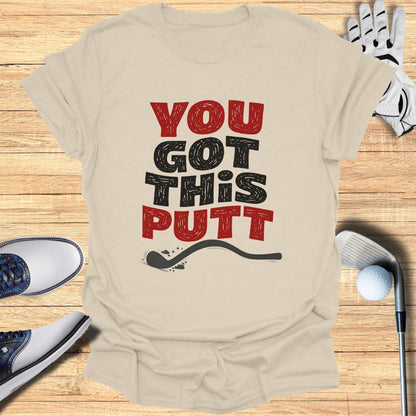 Beige t-shirt with "YOU GOT THIS PUTT" text and golf accessories.