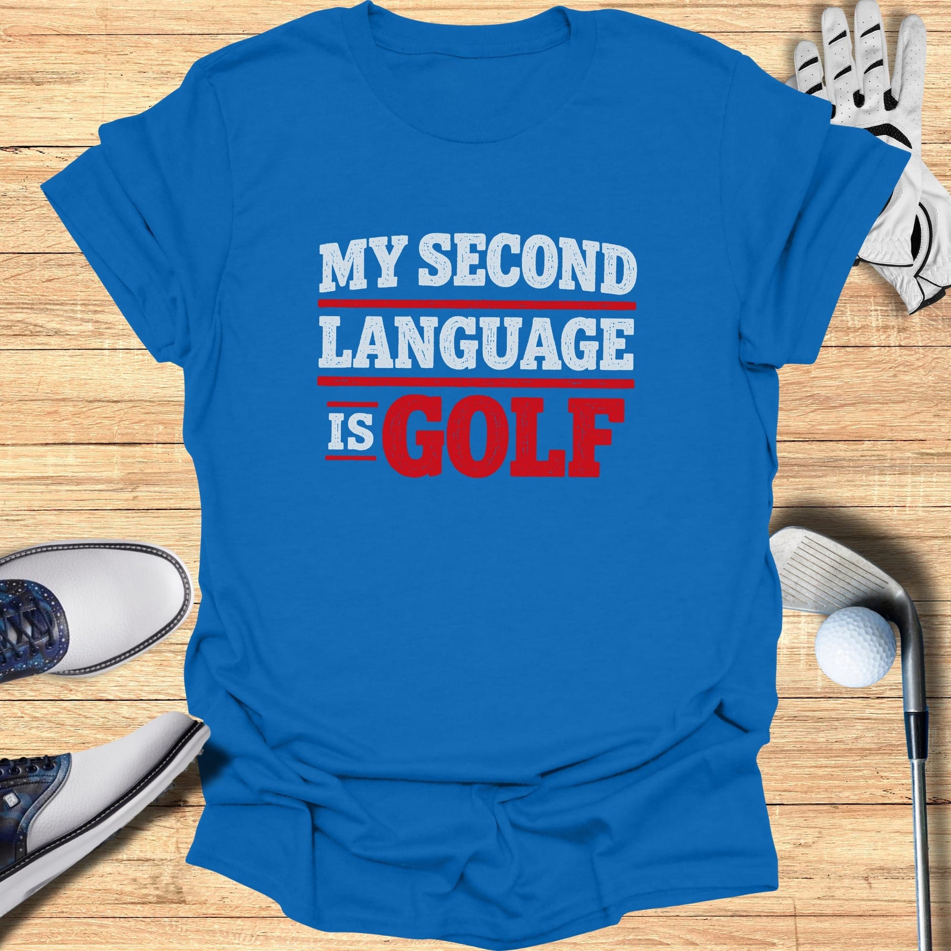 Blue t-shirt with red and white text "MY SECOND LANGUAGE IS GOLF".