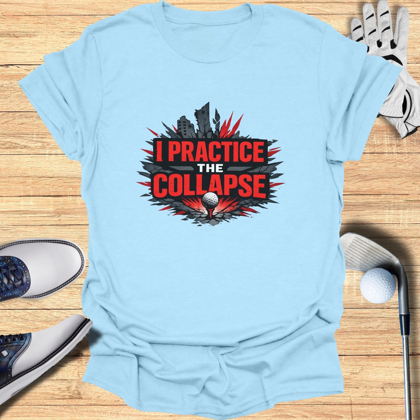 Light blue t-shirt with "I PRACTICE THE COLLAPSE" graphic over a golf ball.