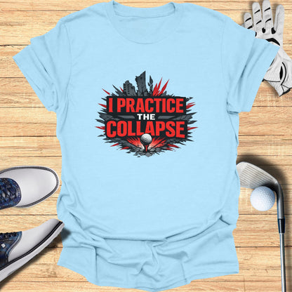 Light blue t-shirt with "I PRACTICE THE COLLAPSE" graphic over a golf ball.