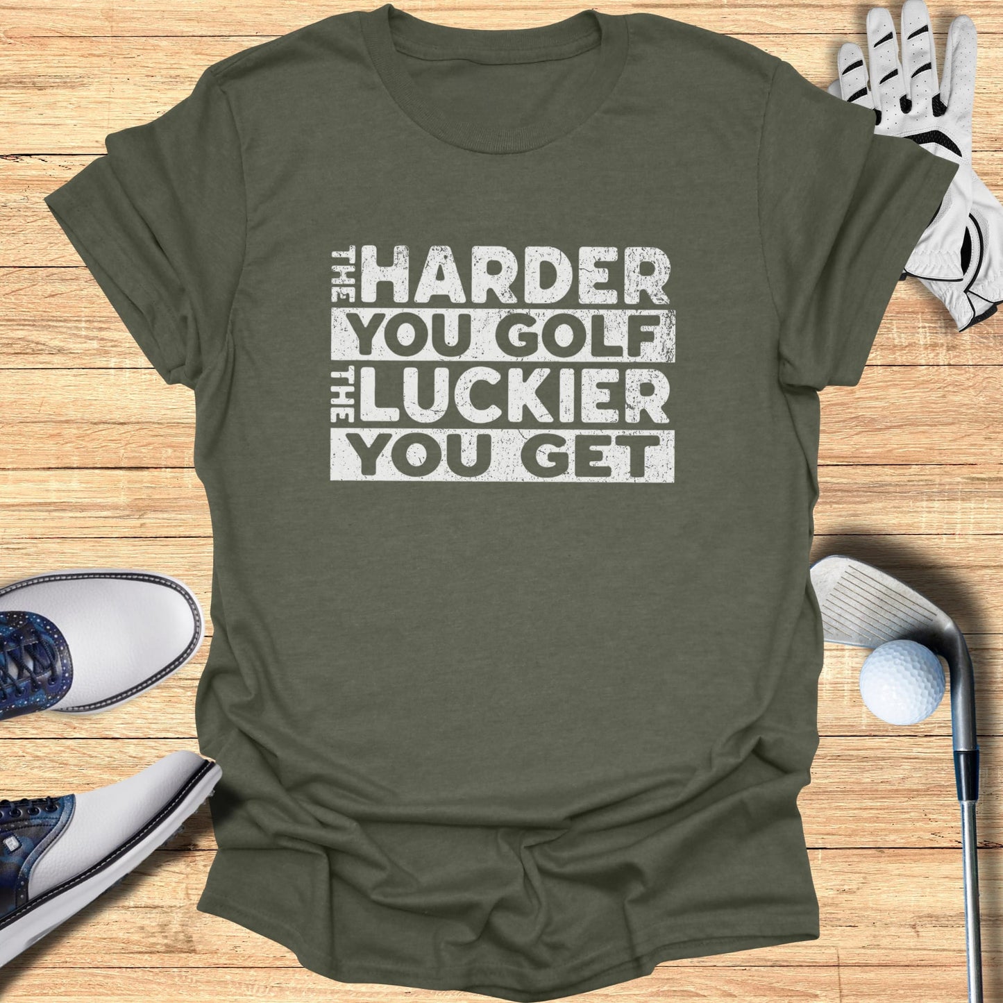 T-shirt with "The Harder You Golf, The Luckier You Get" text.
