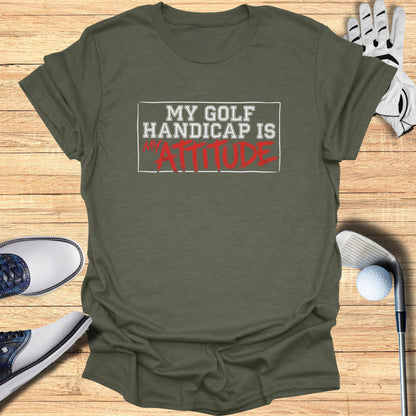 T-shirt with "MY GOLF HANDICAP IS ATTITUDE" text and golf accessories.