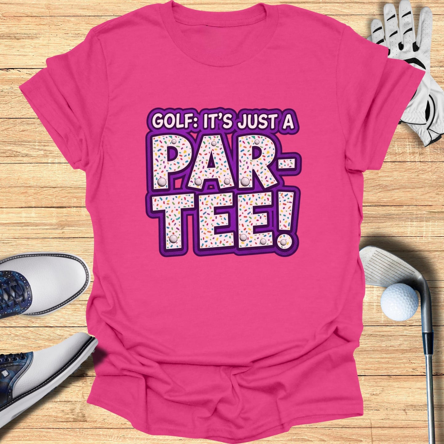 Pink t-shirt with "Golf: It's Just a Par-Tee!" text and sprinkles design.