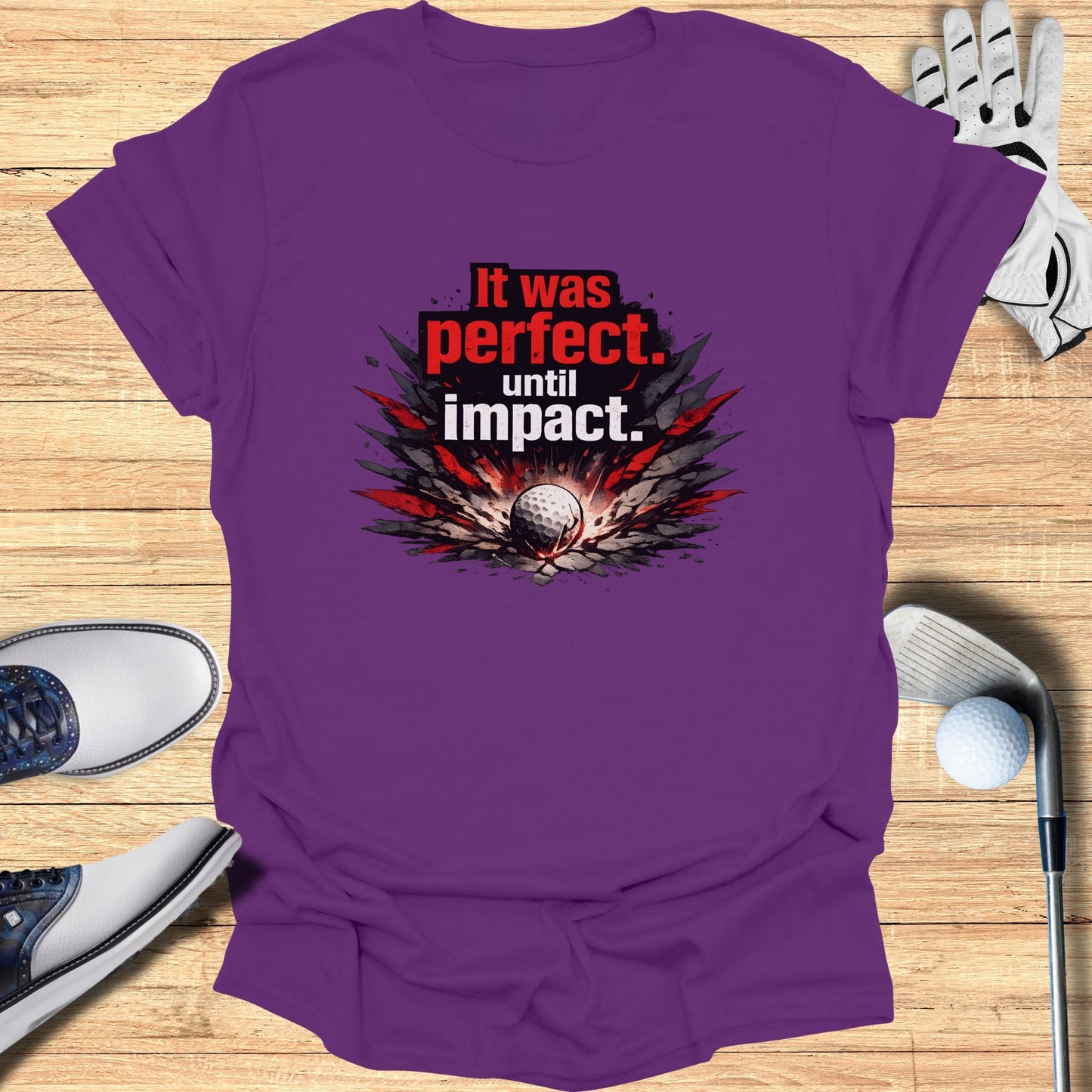 Purple t-shirt with "It was perfect. until impact." and golf graphic.