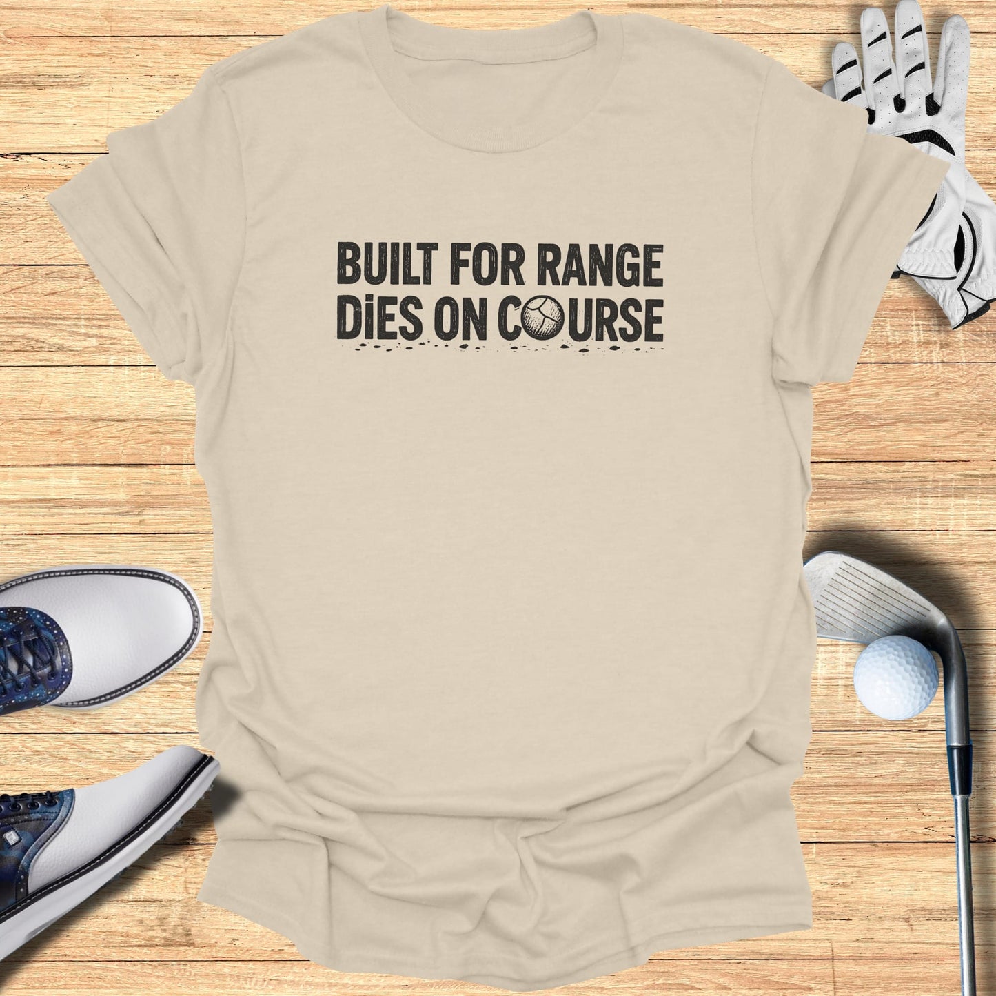 T-shirt with "Built for Range Dies on Course" text and golf accessories.