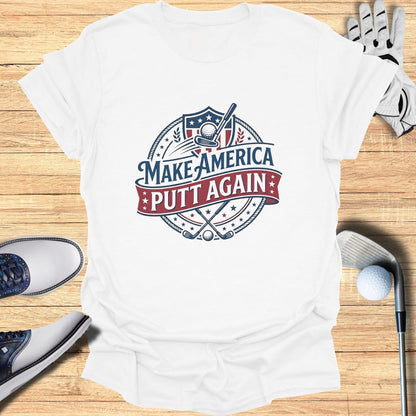 White t-shirt with "Make America Putt Again" golf logo and crossed clubs.