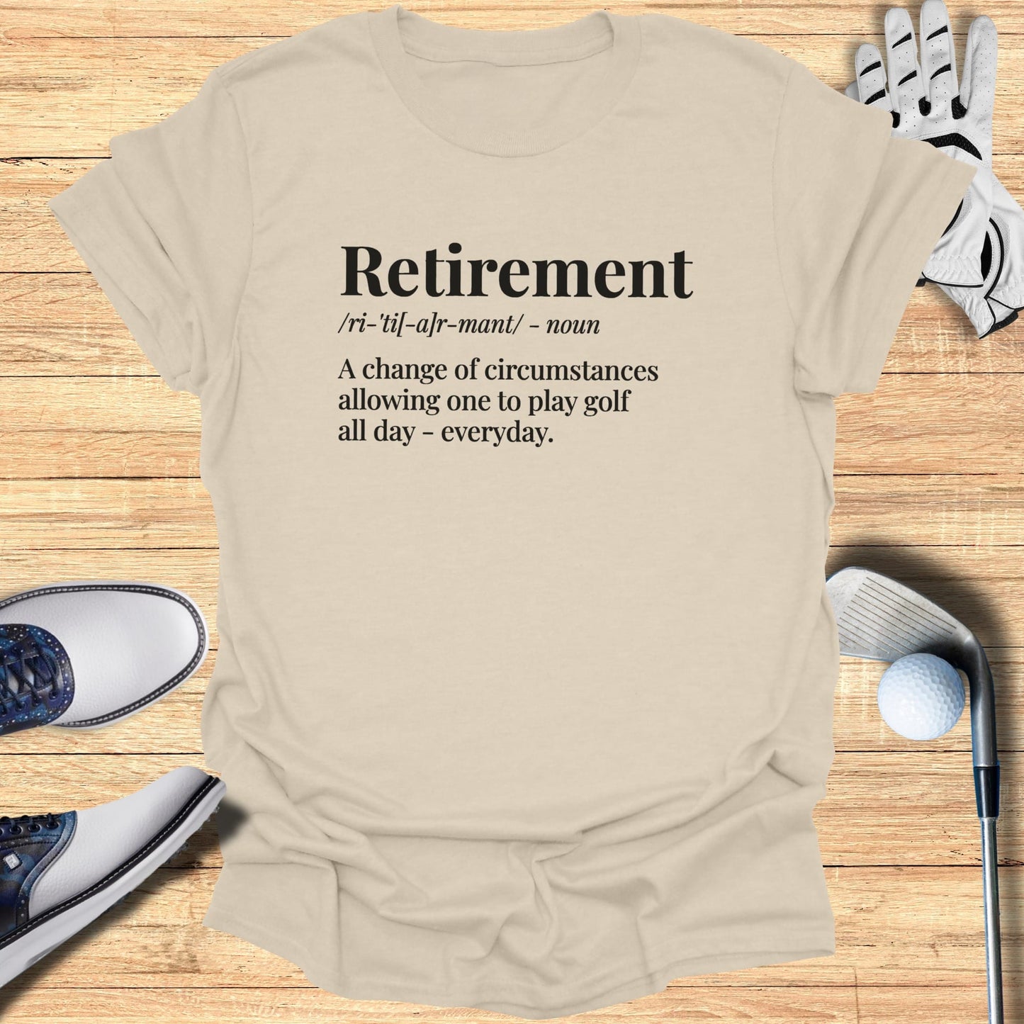T-shirt with definition of retirement as playing golf all day.