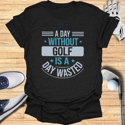 Black t-shirt with "A Day Without Golf Is A Day Wasted" slogan.