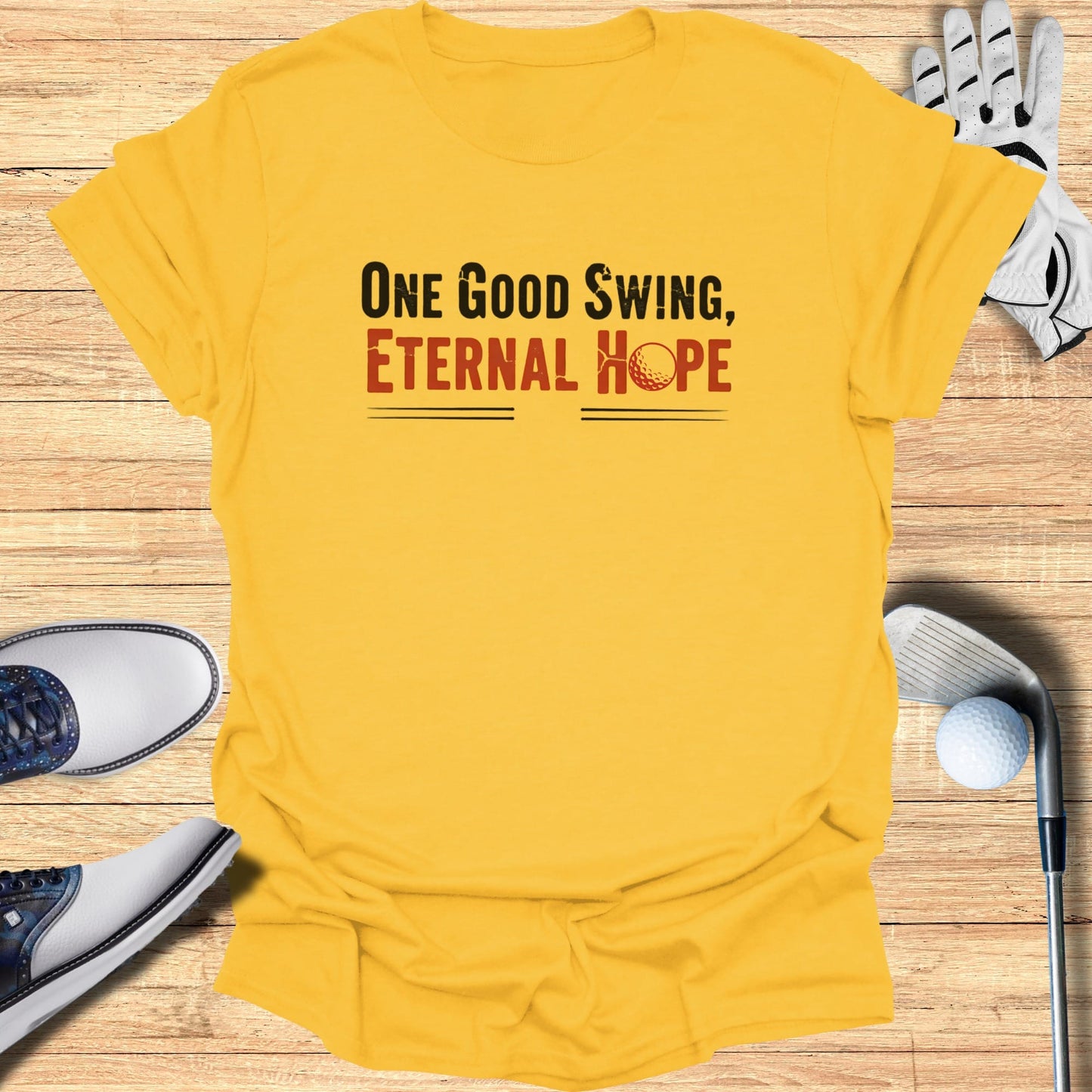 Yellow t-shirt with "One Good Swing, Eternal Hope" text.