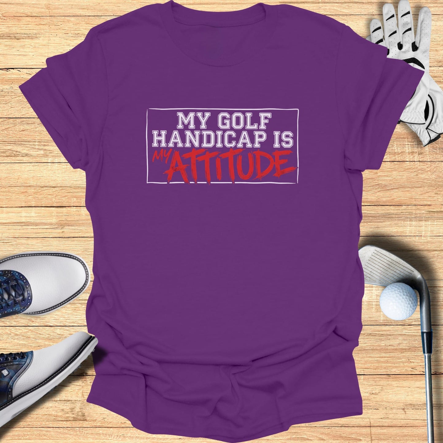 Purple t-shirt with "My Golf Handicap Is Attitude" text.
