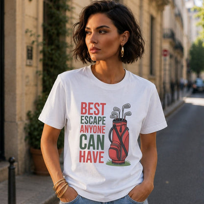 White t-shirt with graphic of a red golf bag and clubs, text "BEST ESCAPE ANYONE CAN HAVE".