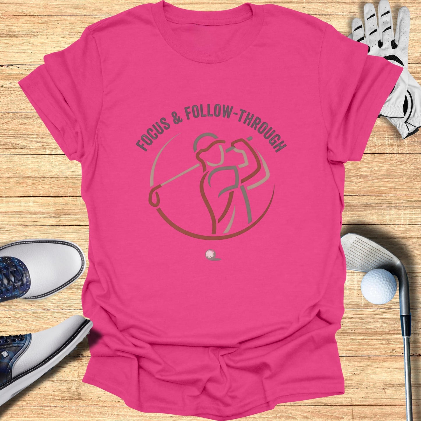 T-shirt with golf graphic and text "FOCUS & FOLLOW-THROUGH".
