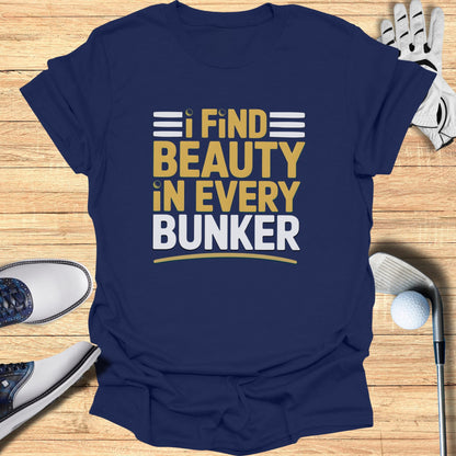 Navy t-shirt with text "I FIND BEAUTY IN EVERY BUNKER."