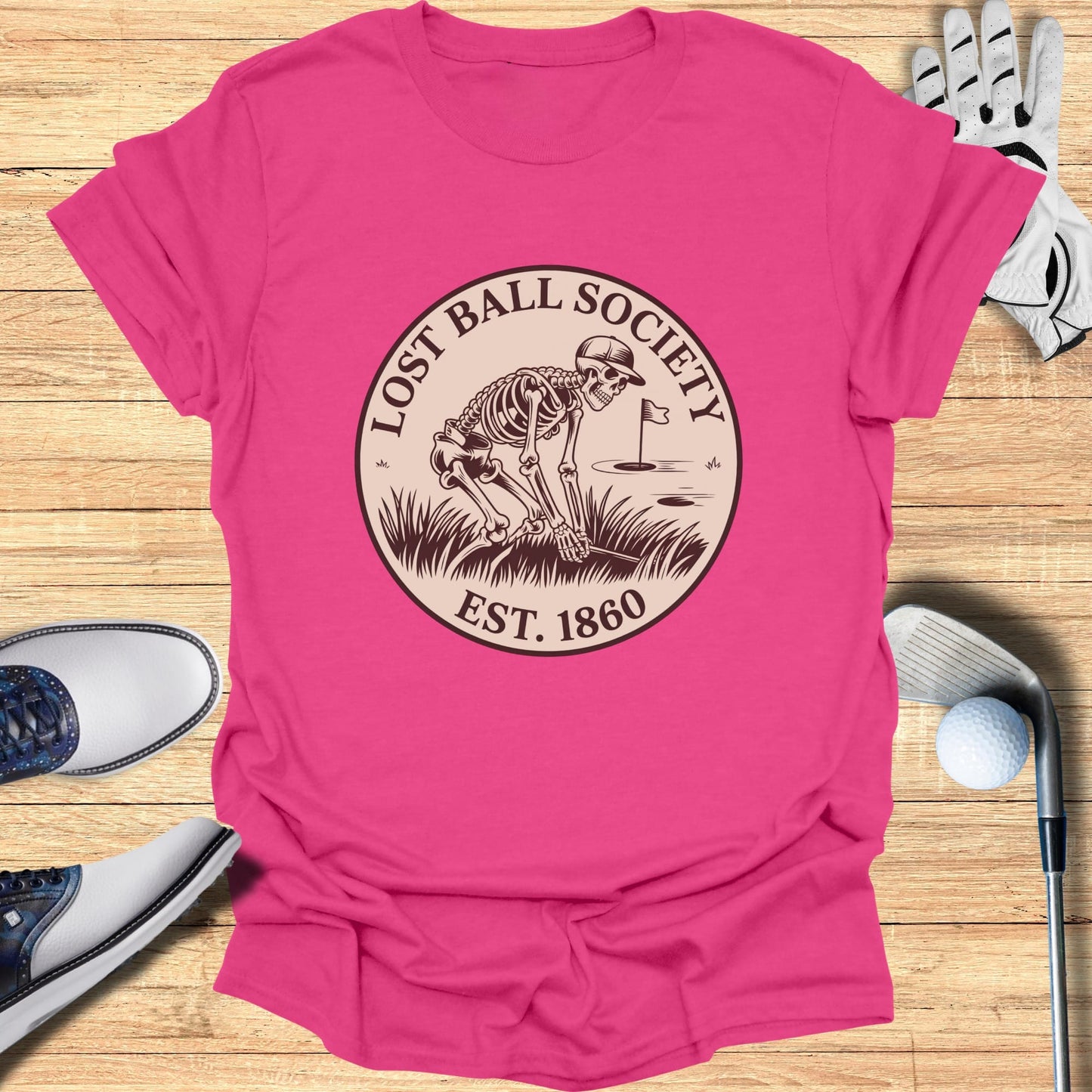 Pink t-shirt with "Lost Ball Society Est. 1860" and skeleton golfing graphic.