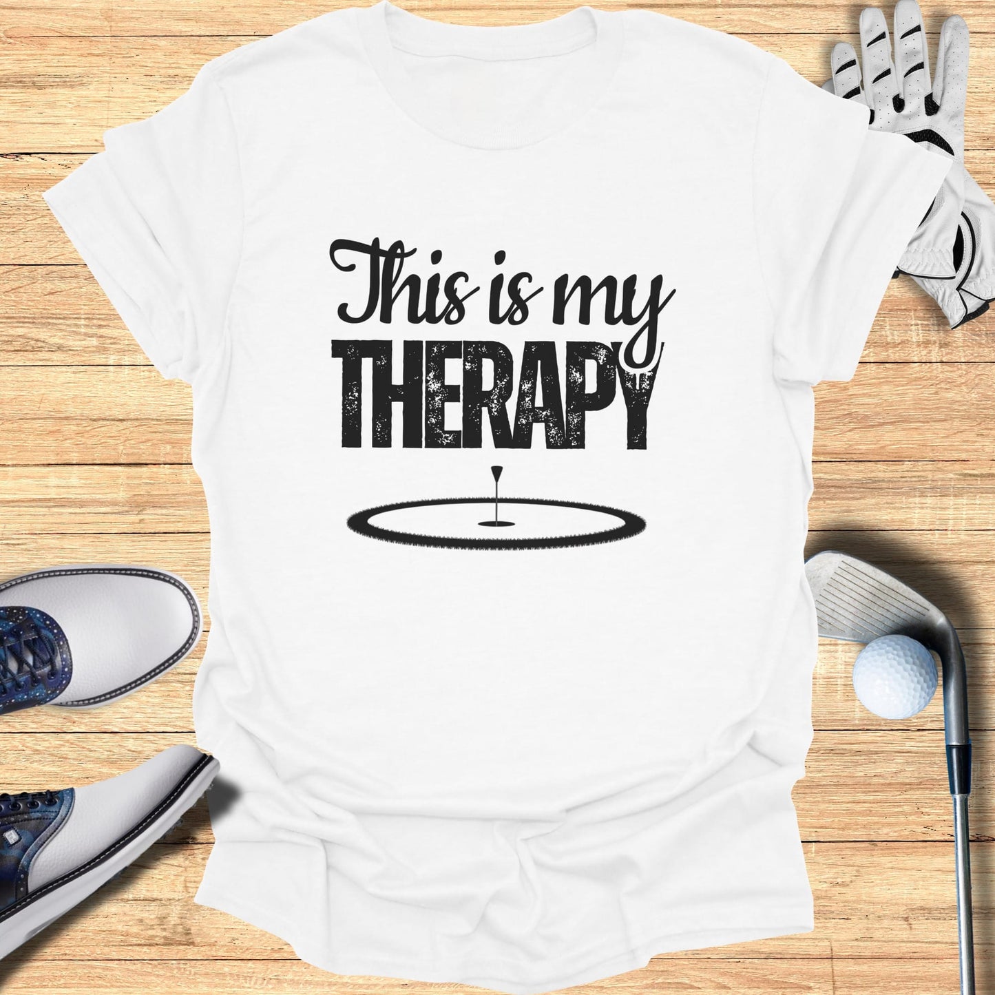 White t-shirt with "This is my THERAPY" text and a golf course graphic.