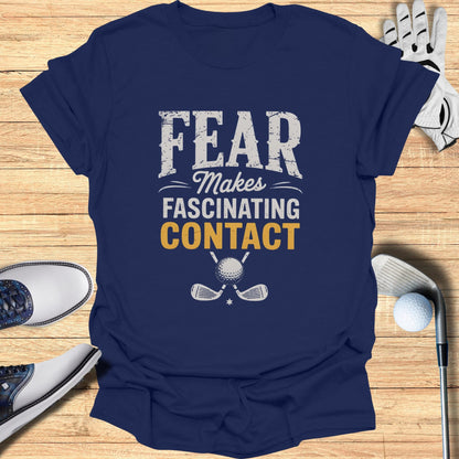 Navy t-shirt with "Fear Makes FASCINATING CONTACT" text and crossed golf clubs.