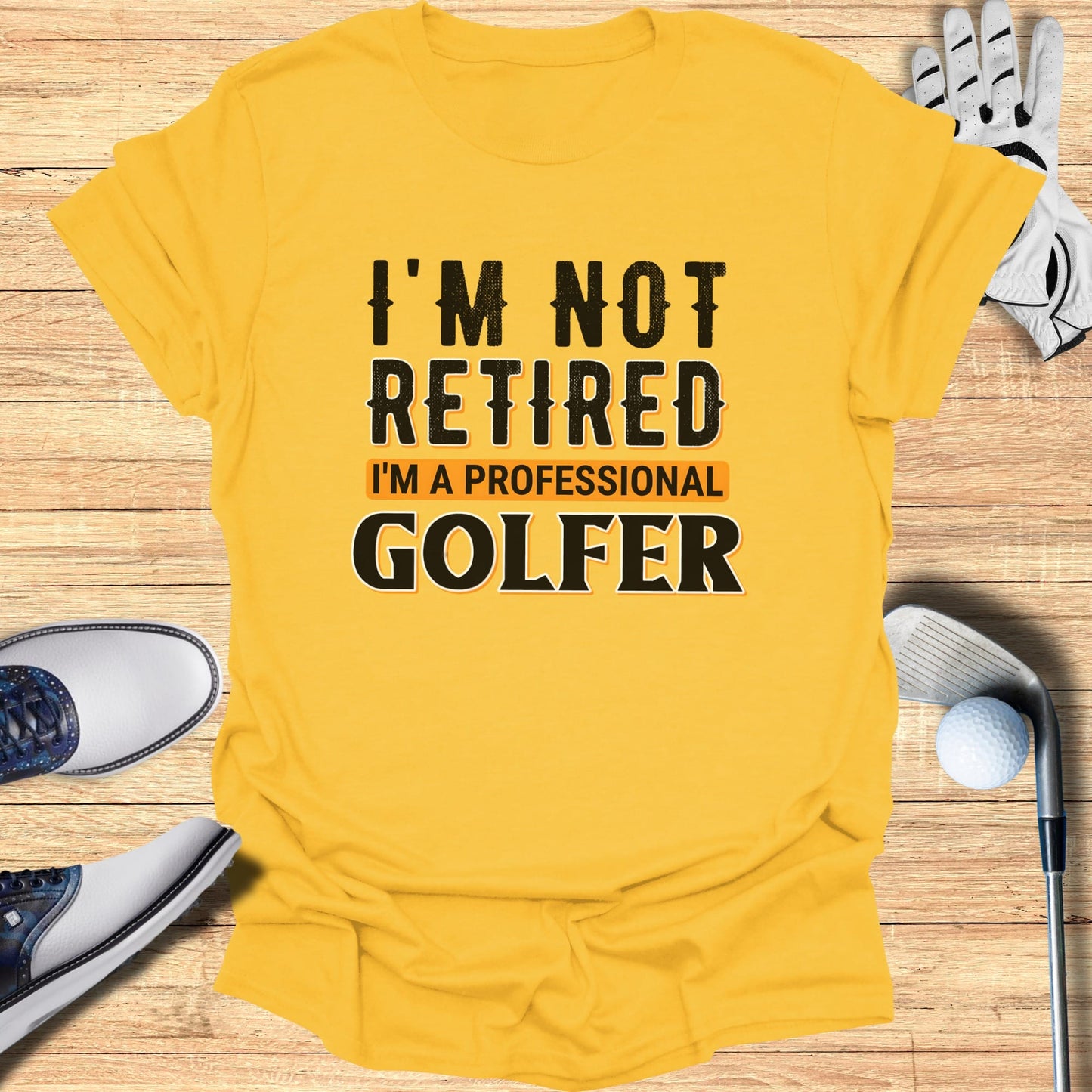Yellow t-shirt with "I'm Not Retired I'm a Professional Golfer" text.