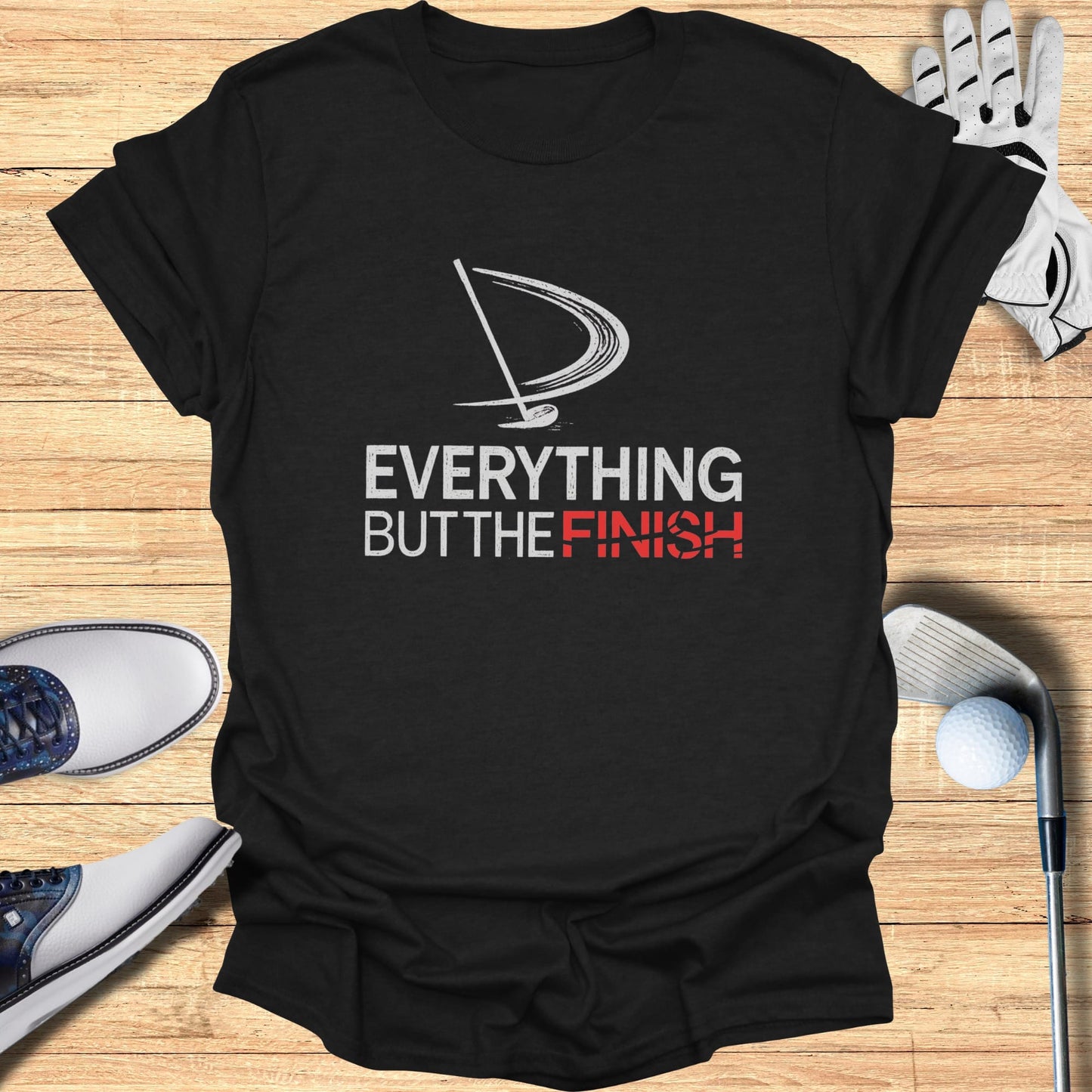 Black t-shirt with "EVERYTHING BUT THE FINISH" text and golf graphic.