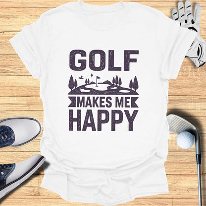 White t-shirt with "GOLF MAKES ME HAPPY" text and golf accessories.