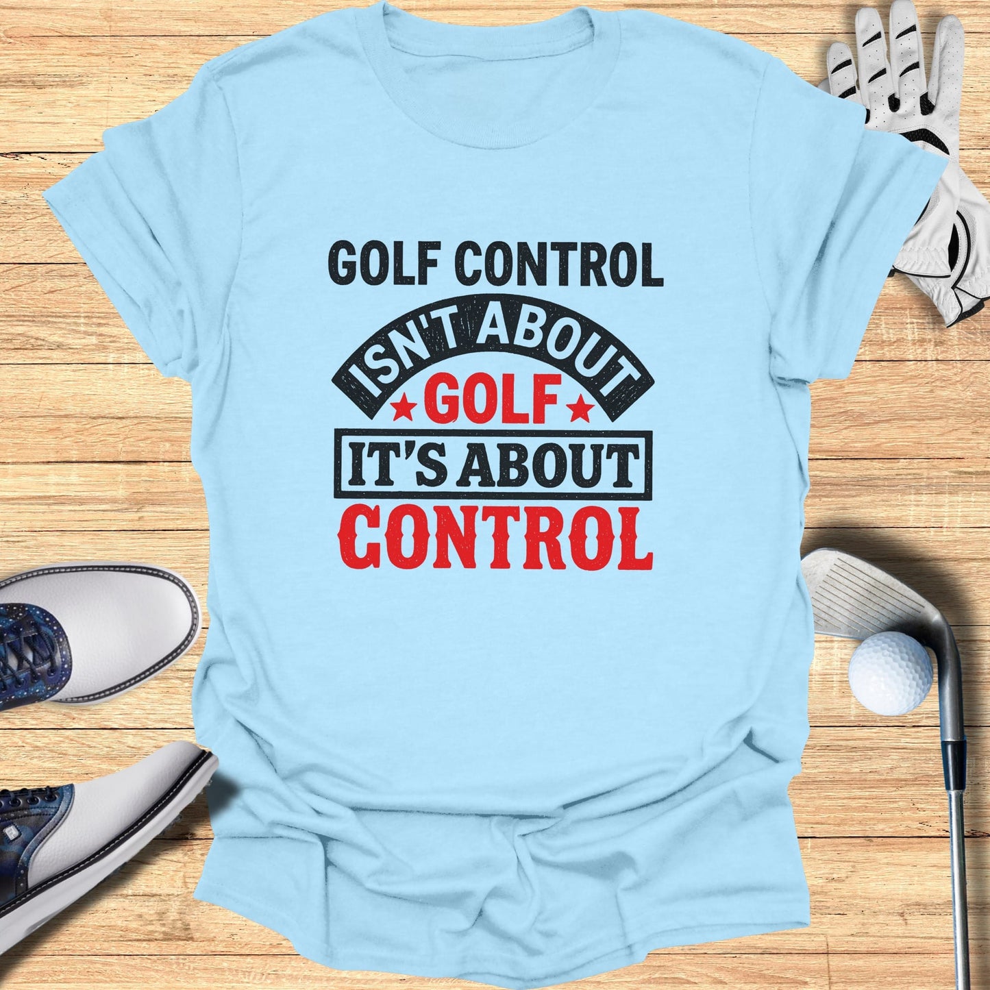 Light blue t-shirt with red text "GOLF CONTROL ISN'T ABOUT GOLF IT'S ABOUT CONTROL".