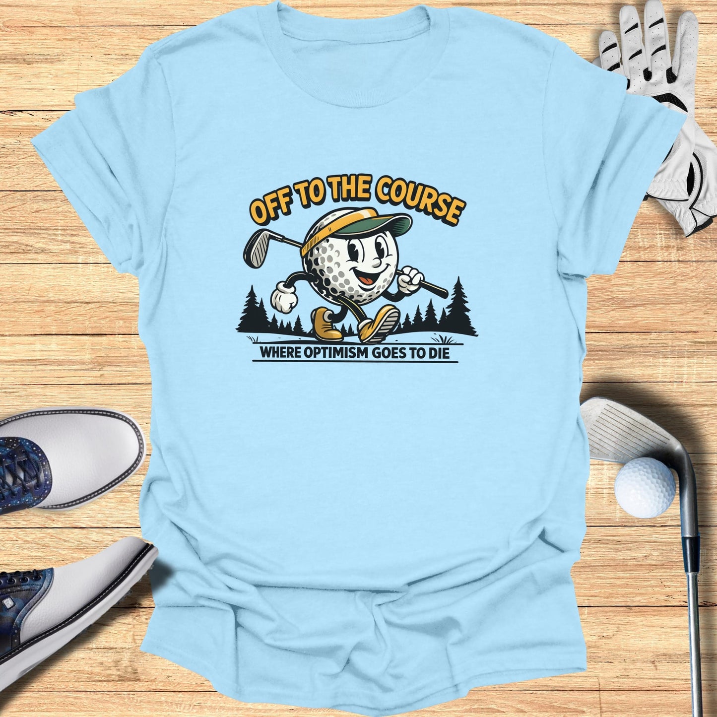 Cartoon golf ball wearing a hat and carrying a club, "OFF TO THE COURSE WHERE OPTIMISM GOES TO DIE".