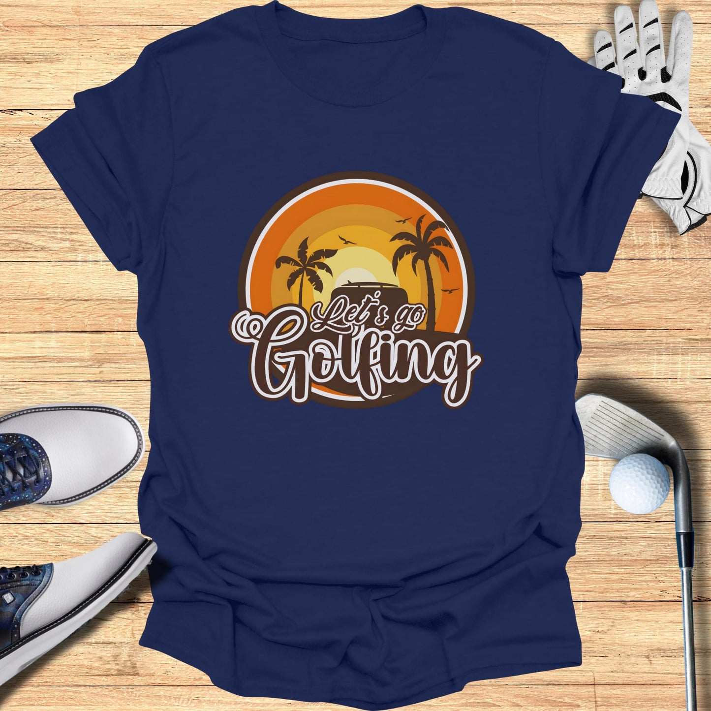 Navy t-shirt with "Let's Go Golfing" text and a sunset graphic.