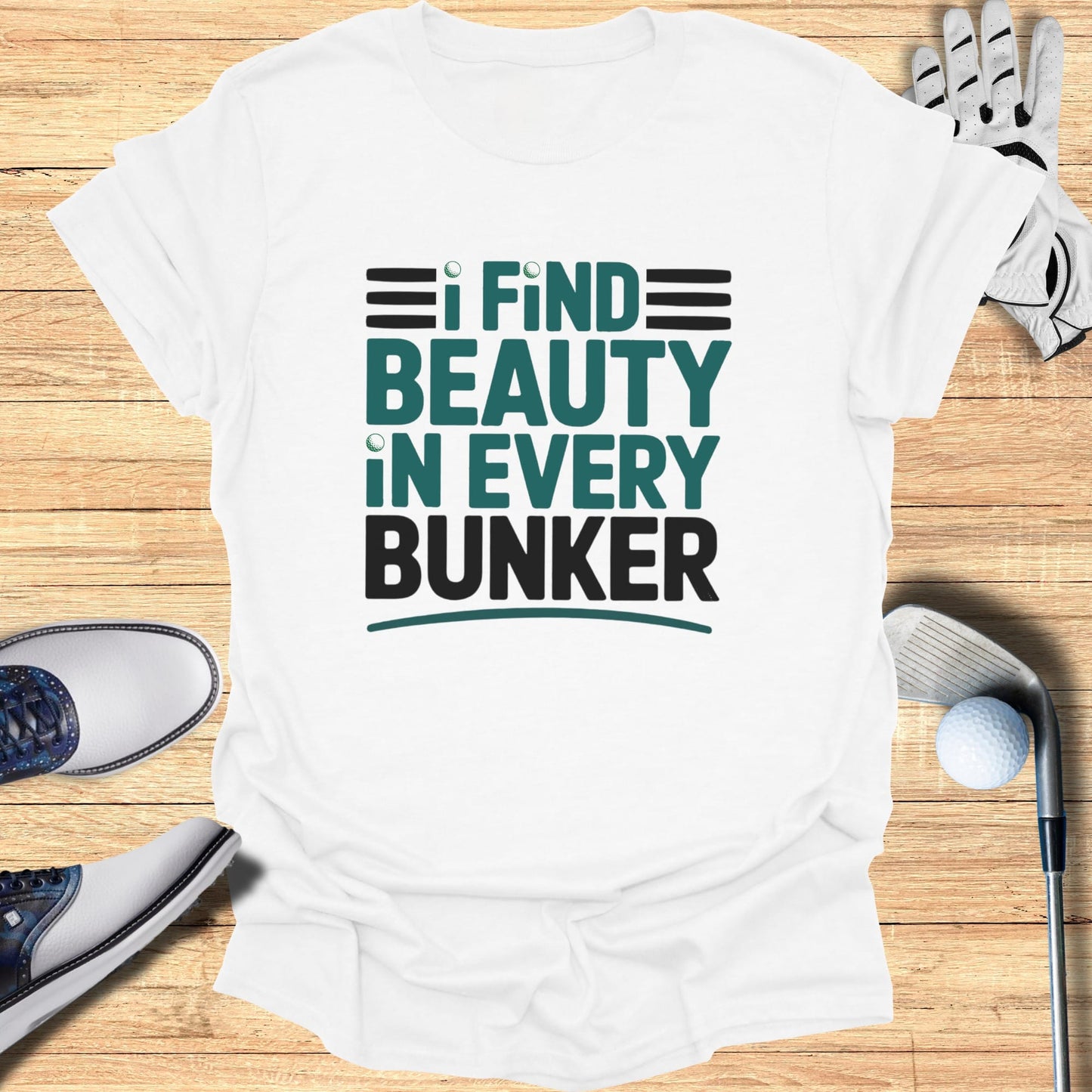 White t-shirt with "I find beauty in every bunker" slogan.
