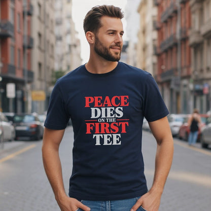 Man wearing a navy t-shirt with "PEACE DIES ON THE FIRST TEE" text.