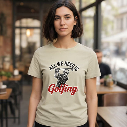 Beige t-shirt with skull golfer graphic and "All We Need Is Golfing" text.