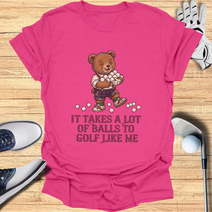 Bear with golf balls on pink t-shirt with text "IT TAKES A LOT OF BALLS TO GOLF LIKE ME."