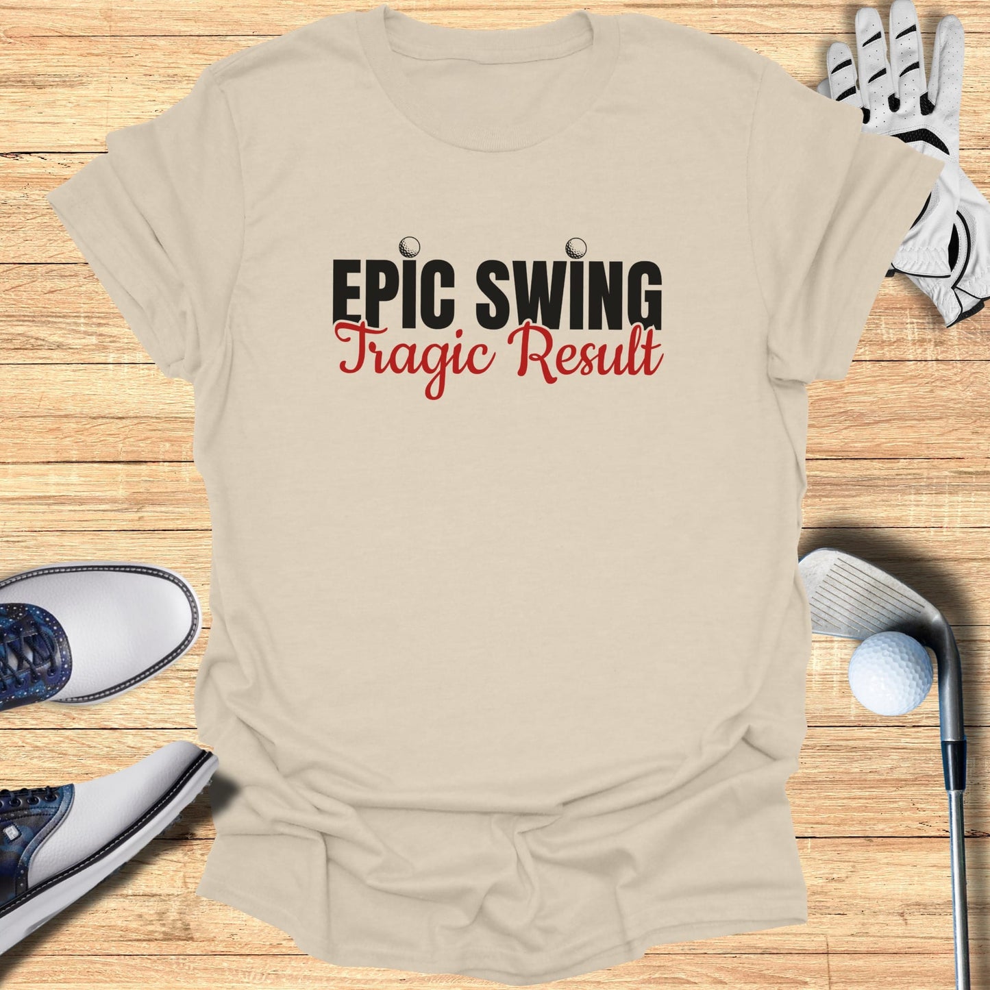 Cream t-shirt with "Epic Swing Tragic Result" text, golf clubs, and shoes.