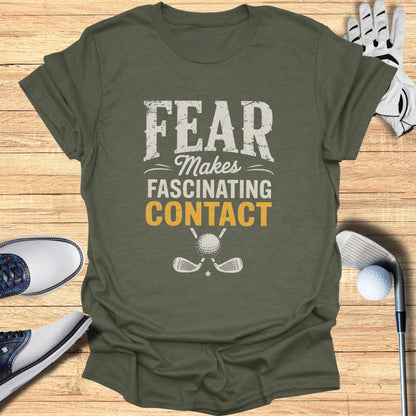 T-shirt with "FEAR MAKES FASCINATING CONTACT" and crossed golf clubs.