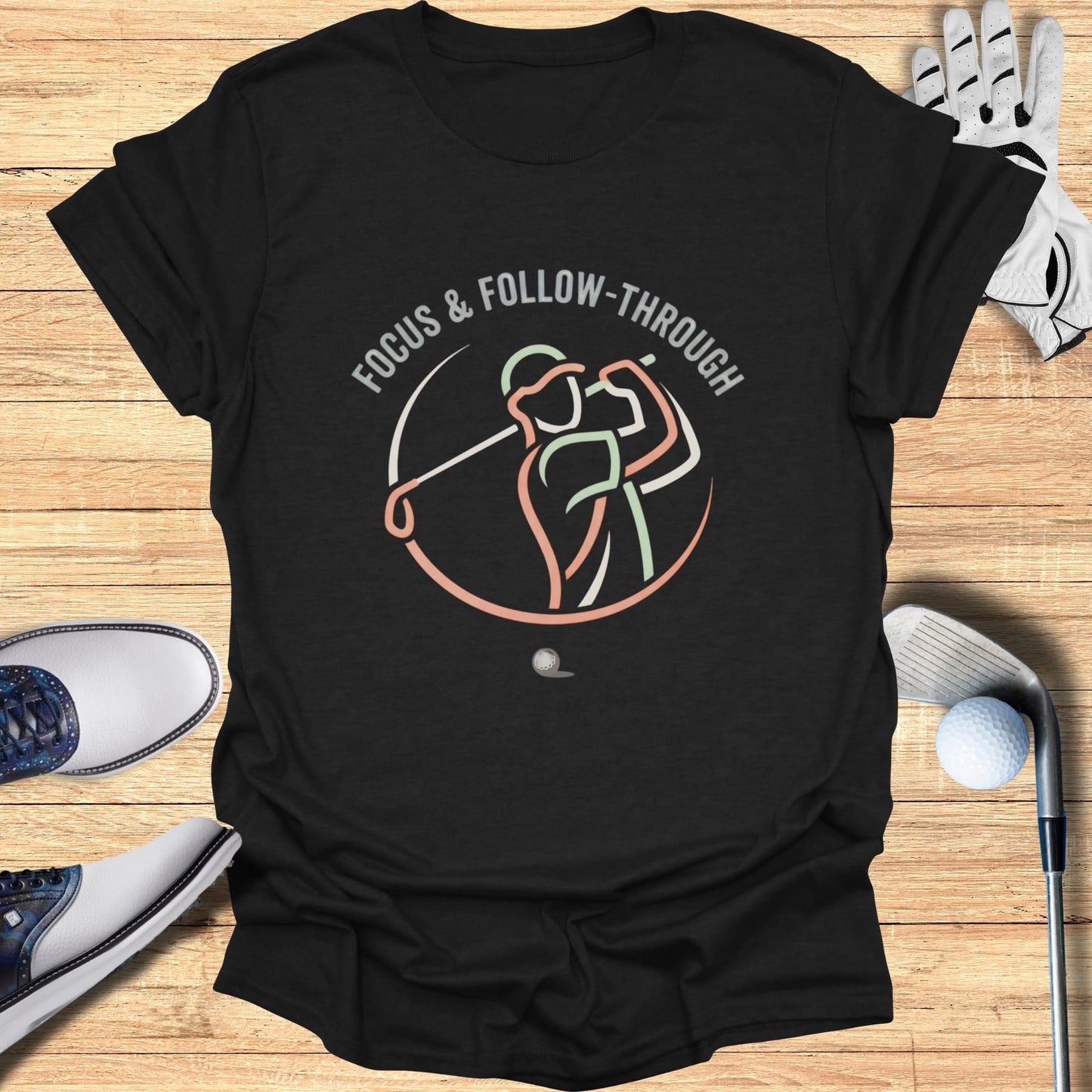 Black t-shirt with "FOCUS & FOLLOW-THROUGH" text and golf swing graphic.