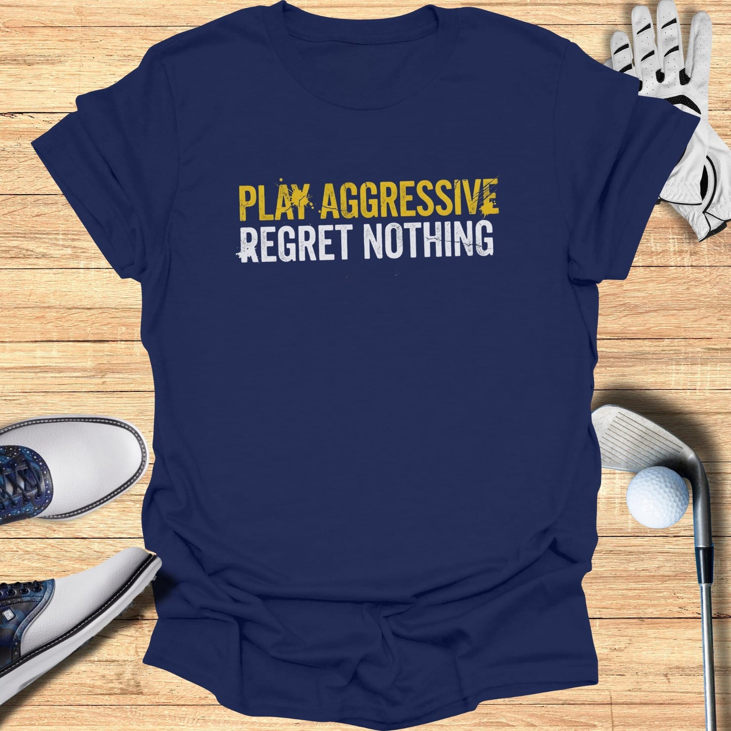 Navy t-shirt with yellow text "PLAY AGGRESSIVE REGRET NOTHING".