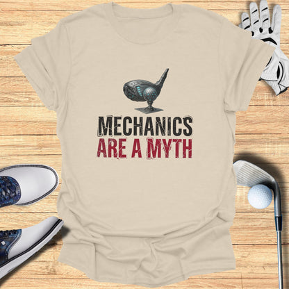 Light beige t-shirt with "Mechanics Are A Myth" graphic and golf accessories.