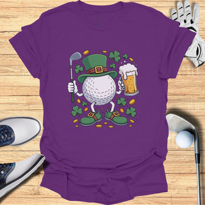 Golf ball character in a St. Patrick's Day hat and outfit holding a beer.