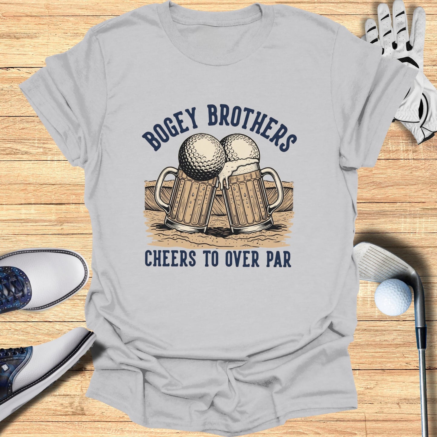 Grey t-shirt with two beer mugs shaped like golf balls and text "Bogey Brothers Cheers to Over Par".