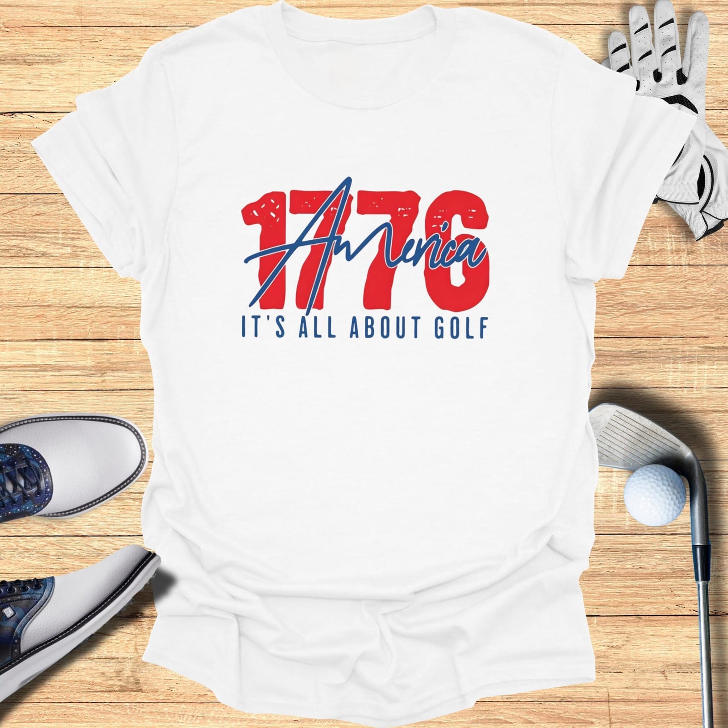 White t-shirt with "1776 America" and "It's All About Golf" text.