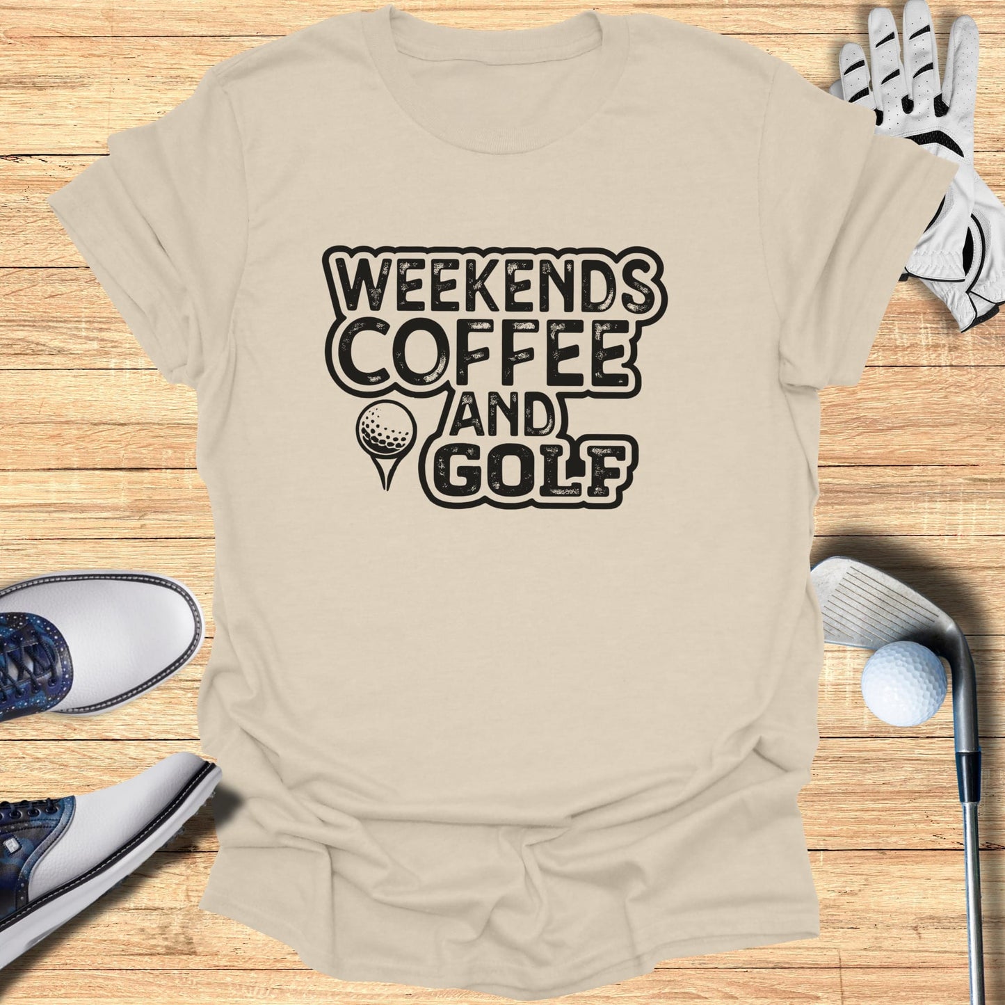 T-shirt with "Weekends Coffee and Golf" text, golf shoes, glove, and club.