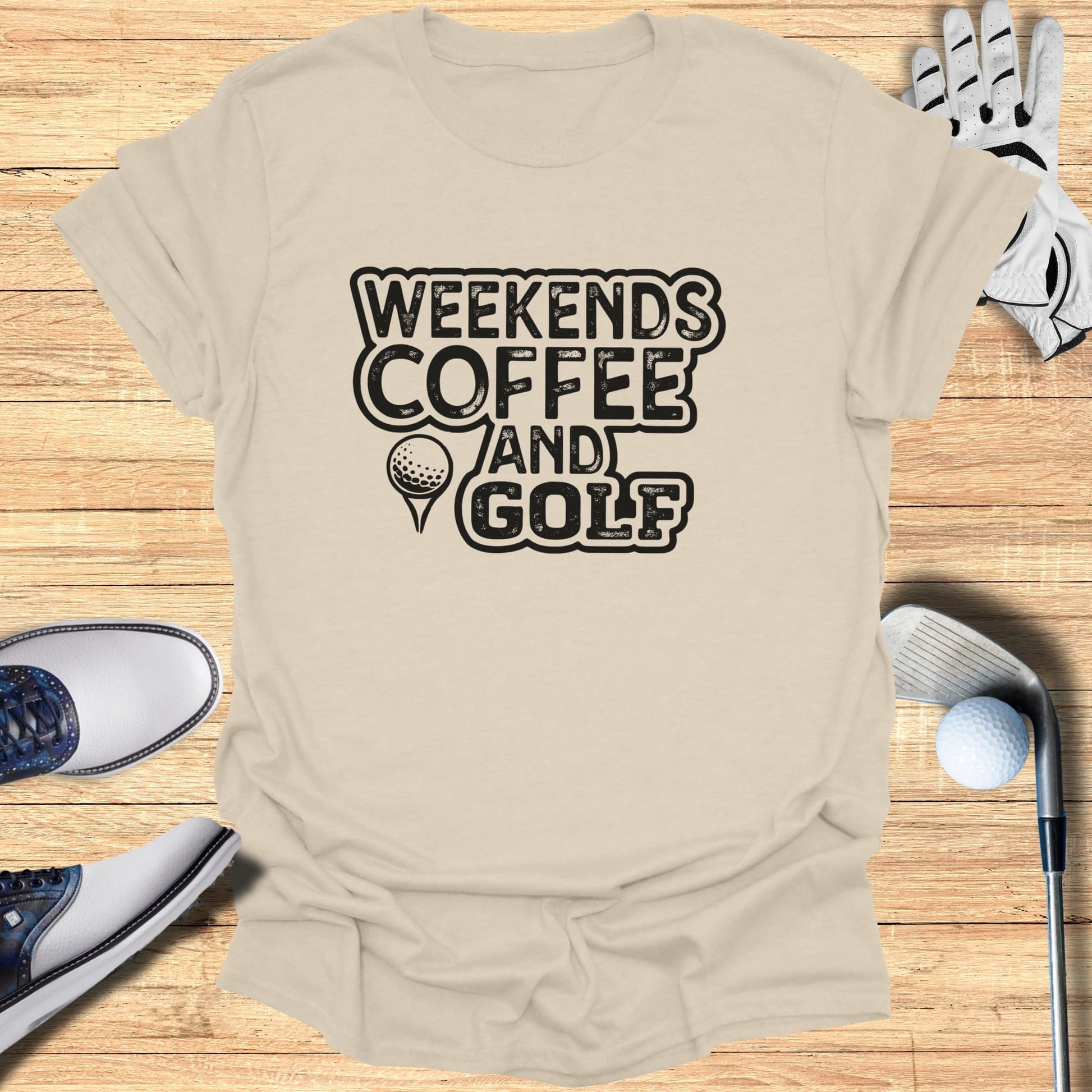 T-shirt with "Weekends Coffee and Golf" text, golf shoes, glove, and club.